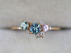 Oct 10, 2021 - Check out our shop for more items https://www.etsy.com/shop/VimleshBadaya Cluster ring, Cluster engagement ring, Aquamarine ring, Aquamarine engagement ring, sapphire cluster ring, aquamarine and diamond ring Available in 9k/14k/18k yellow, rose or white gold. Same design can be made also with Engagement Ring Aquamarine, Engagement Ring Sapphire, Sapphire Cluster Ring, Raw Diamond Engagement Rings, Diamond Rings With Price, Rough Diamond Ring, Ring Cluster, Ring Sapphire, Diamond Stacking Rings