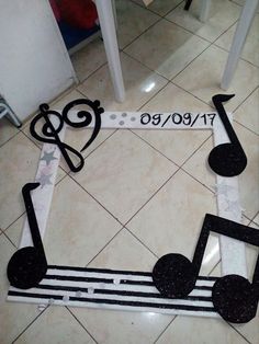 music notes are arranged in the shape of a treble strip with musical notes painted on it