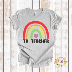 Tk Teacher Shirt, Retro Floral Transitional Kindergarten Shirt, Tk Teacher, Tk Shirt, Shirt for Teacher, Teacher Gifts, Tk Teacher Tshirt, Teacher Appreciation, Teacher Gift, Gift for TK Teacher You select the size and color of your shirt.  There is a photo showing you the shirt colors. *Note the difference between solid colors and heather colors. The shirt colors available for the listing you are looking at will be in the drop-down menu. The shirts used are adult Bella+Canvas 3001 Unisex shirts Rainbow Cotton T-shirt, Pre-shrunk, Rainbow Cotton T-shirt Pre-shrunk, Pre-shrunk Cotton Rainbow Colored Tops, Pre-shrunk Cotton Rainbow Tops, Rainbow Pre-shrunk Cotton Top, Rainbow Colored Pre-shrunk Cotton Tops, Cotton Rainbow Pre-shrunk Tops, Tk Teacher, Transitional Kindergarten