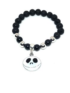 Jack Skellington beaded stretch bracelet. Handcrafted. Jewelry pouch included for gift giving. Will fit most mid size wrists. Casual Beaded Bracelets With Black Beads As Gift, Silver Beaded Wristband For Gifts, Silver Beaded Wristband As Gift, Casual Black Beads Stretch Bracelet Gift, Casual Black Beads Stretch Bracelet, Casual Nickel-free Beaded Bracelets As Gift, Casual Stretch Bracelet With 8mm Beads For Gifts, Casual Stretch Bracelet With 8mm Beads As Gift, Casual Black Beads Wristband Gift