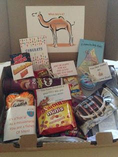 a box filled with assorted candy and cards