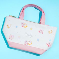 Bring this handbag-style lunch tote with you to school or work! It’s decorated with kawaii prints of Kirby and Waddle Dee stargazing together! The bag also comes with a removable insulated pouch that can keep your snacks and drinks fresh. Comes with a removable zippered insulated pouch Can also be used as a mini tote bag Kawaii Prints, Waddle Dee, Kawaii Bags, Nintendo Characters, Cooler Lunch Bag, Nintendo Game, Lunch Tote, Game Characters, Kawaii Shop