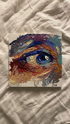 an eye painted on a piece of paper