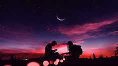 two people sitting on a hill at night with the moon in the sky above them