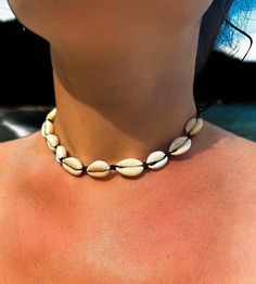 Handmade cowrie shell choker.  Fully adjustable (33-38cm) with cowrie shells strung on black waterproof cord.  Cowrie shells measure 17 x12 mm. 🌊 🏊✅ Pool & ocean proof.  📦✅ Shipped FREE in the UK and dispatched on the SAME DAY where possible. 🎁✅ Gift wrap option available.  Visit our Etsy site to view other Ben's Beach jewellery --> https://www.etsy.com/uk/shop/BensBeach 🌐 Visit our main site --> https://bensbeach.com/ to view our wider selection and subscribe for updates (we do not spam) r Summer Beach Cowrie Shell Choker, Black Necklaces For Summer Vacation, Black Summer Vacation Necklaces, Black Necklace For Summer Vacation, Adjustable Black Choker For Summer, Summer Vacation Cowrie Shell Choker, Black Vacation Necklaces, Black Necklaces For Vacation, Casual Summer Choker For Vacation