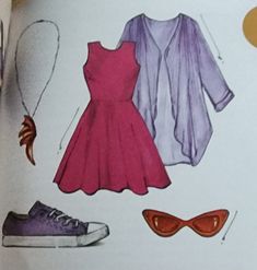 an open book with different types of clothes and shoes on the pages, including one woman's dress