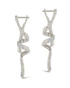 Be the envy of red carpets around the world with our Carrie Drop Studs. Adorn your earlobes with celebrity-inspired bling, featuring shimmery CZ stones that will have you feeling like a million bucks. With these statement earrings, you'll be the center of attention at any event! Materials: 14K gold or rhodium plated brass, cubic zirconia Features: 2" drop, 0.45" width, 1.5mm stones, Lead & Nickel free, hinged post back Formal Spiral Jewelry With Matching Earrings, Formal Spiral-shaped Jewelry With Matching Earrings, Silver Elegant Wrap Earrings For Party, Elegant Spiral Wrap Earrings, Elegant Silver Wrap Earrings For Party, Elegant White Gold Spiral Earrings, Modern Twist Silver Earrings For Party, Dazzling Pierced Diamond Earrings For Party, Dazzling Earrings With Prong Setting For Party