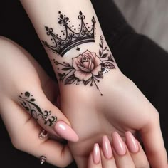 two women with matching tattoos on their hands and one has a crown tattoo on her wrist