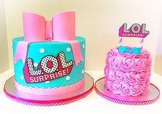 two cakes decorated with pink and blue frosting, one has a bow on top