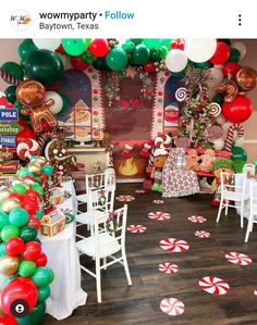 a room filled with lots of balloons and candy canes on the floor next to tables