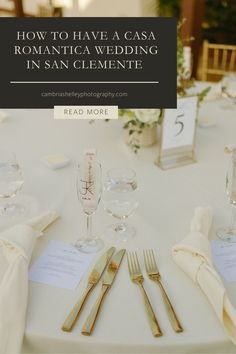 the table is set with goldware and place settings