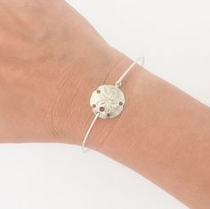 "Sand Dollar Bracelet - Sand Dollar Jewelry - A silver tone sand dollar charm will be transformed into a dainty & delicate sand dollar bangle bracelet with bangle band choice of silver filled or sterling silver. This Summer bangle bracelet is perfect for cute beach jewelry, any nautical summer outfit, beach bridesmaids gifts, or for beach wedding jewelry for the bride :) If you're having a beach theme wedding and need more sand dollar bangles than shown as available for beach bridesmaid jewe Silver Charm Bracelet With Lobster Clasp For Beach, Silver Charm Bracelet For The Beach, Hypoallergenic Silver Beach Jewelry, Hypoallergenic Silver Jewelry For Beach, Nickel-free Sterling Silver Bracelets For The Beach, Adjustable Silver Charm Bracelet With Oyster Design, Sterling Silver Bracelets For Beach, Adjustable Silver Charm Bracelet For Beach, Silver Adjustable Charm Bracelet For Beach