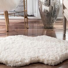 a white rug on the floor in a living room