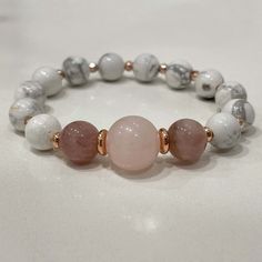 Stylish bracelet made out of white howlite, rose quartz and rose jade. 🌸⠀ ⠀ White Howlite is a calming stone, brings compassion and sensitivity to its wearer.⠀ ⠀ - soothes the body, mind, spirit ⠀ - helps balance calcium levels in the body⠀ - great for people who overreact or too emotional ⠀ - connects to the third-eye chakra⠀ All jewelry comes in premium packaging, gift ready, plus a stylish postcard All of our jewelry are designed and crafted by hand in our atelier in Bulgaria with careful at Adjustable White Rose Quartz Jewelry, Elegant White Rose Quartz Crystal Bracelet, Healing Rose Quartz Beaded Bracelets In Rose Gold, Healing Rose Gold Rose Quartz Beaded Bracelet, White Rose Quartz Beaded Bracelets As Gift, Pink Beaded Bracelets For Meditation, White Rose Quartz Beaded Bracelet As Gift, White Rose Quartz Crystal Bracelet With Round Beads, White Rose Quartz Crystal Bracelet As A Gift