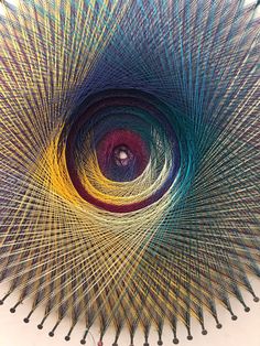 an image of a colorful object that looks like a peacock's eye in the center