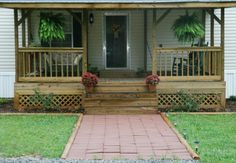 the front porch of a house with steps leading up to it