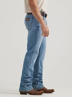 NOTHING BEATS AN ORIGINAL, BUT THIS MIGHT Since 1947, Wrangler® jeans have been a cowboy-approved wardrobe staple. Inspired by our Western heritage, these Wrangler® Retro® jeans combine our most iconic features with contemporary fits and washes. This updated classic features the same worn leather patch with our rope logo, 'W' stitching on the back pockets, and five-pocket styling. These men's slim bootcut jeans feature a streamlined silhouette through the seat, thigh, and knee, but the leg widen Best Bootcut Jeans, Men Workwear, Gentlemen Style, Slim Bootcut Jeans, Twisted X Boots, Mens Bootcut Jeans