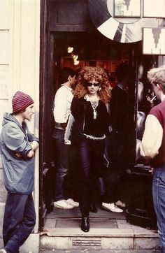 a group of people standing outside of a building