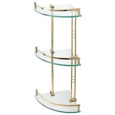 a three tiered glass shelf with gold trimmings and shelves on each side