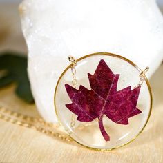 Our preserved Maple leaf necklace is the PERFECT way to embrace the fall season.This necklace is made with tiny leaves, cut from larger maple leaves. They are preserved in clear  bio-resin and set in a 30 mm silver or gold-plated frame. This fall beauty will come to you on either a 24k gold-fill chain or a sterling silver chain, you choose the length!Please keep in mind that each necklace will be a bit different! Each leaf may vary slightly in color or shape, due to the nature of "nature" and th Brown Leaf-shaped Jewelry For Gift, Red Nature-inspired Jewelry For Gifts, Handmade Burgundy Necklace As Gift, Handmade Burgundy Necklace For Gift, Brown Jewelry Gift For Fall, Brown Jewelry For Fall Season Gift, Brown Jewelry For Fall Gifts, Red Pressed Flowers Round Jewelry, Red Round Jewelry With Pressed Flowers