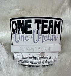 one team one dream sticker on white fur