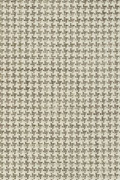 a white and brown checkered fabric with small squares