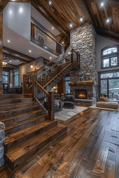 a living room filled with furniture and a fire place in the middle of an open floor plan