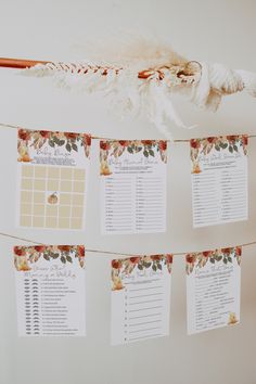 the wedding seating plan is hanging on a string