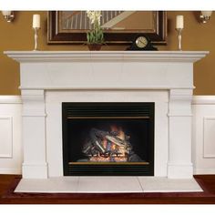 a white fireplace with a mirror above it