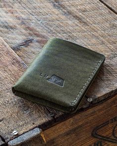 "Unique design and convenient to use. Traveler's Wallet is a handmade leather wallet that can carry up to 8 cards and unfolded cash. This bi-fold wallet will look even better when aged as it's made with Italian vegetable tanned full grain leather. The leather has a beautiful rugged texture which turns darker and shinier over time. No need to use any leather balm as the oils in its users hands will take care of the leather. Choose from several color options. The dimensions: 7,7 cm x 10 cm (3\" x 3.9\") when closed and when opened 16 cm x 10 cm (6.3\" x 3.9\"). Made to order in Finland." Everyday Trifold Wallet With Waxed Finish, Everyday Waxed Finish Trifold Wallet, Minimalist Trifold Wallet For Everyday Carry, Minimalist Everyday Carry Trifold Wallet, Minimalist Trifold Wallet For Everyday, Bifold Waxed Finish Wallets For Everyday Carry, Minimalist Bifold Wallets For Everyday Carry, Minimalist Bifold Wallet For Everyday Carry, Minimalist Everyday Bifold Wallet