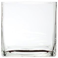 an empty square glass vase on a white background