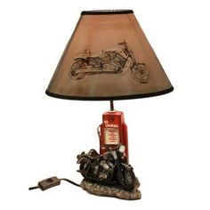 a lamp that is on top of a rock with a motorbike on it