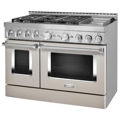 a stainless steel oven with double doors and two burners on each side, in front of a white background