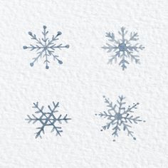 four snowflakes are shown in blue and white