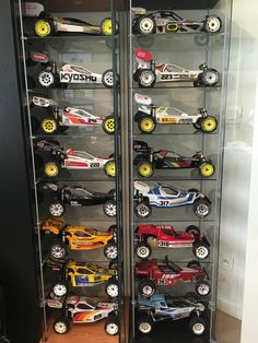 a display case filled with lots of toy cars