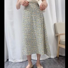 This Darling Skirt Comes In Blue With Yellow Ditzy Floral Print And Features A Back Elastic Band For Stretch, A Side Zipper And A Built In Slip. The Material Is Made Of A Non-Sheer Lightweight And Silky Fabric. The Waist Will Stretch Making It Comfortable To Wear. Super Feminine And Cute! 100% Polyester Size: Small Fits Like A 2-4 In Women’s Fit: Sits High Waisted With A Snug Waist And An A-Line Style Skirt That Hits Above Ankle 12.5” Waist 22” Hip 31” Length Light Blue Non-stretch Skirt For Spring, Non-stretch Light Blue Skirt For Spring, Spring Light Blue Non-stretch Skirt, Light Blue Floral Print Casual Skirt, Light Blue Casual Skirt With Floral Print, Casual Light Blue Floral Print Skirt, Non-stretch Yellow Skirt For Summer, Floral Print Midi Skirt, Silky Fabric