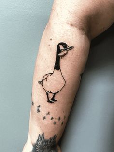 a person with a duck tattoo on their arm