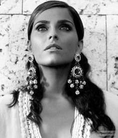 black and white photograph of a woman wearing earrings