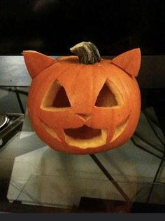 a pumpkin with a cat's head carved into it