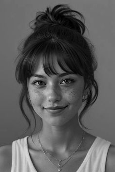 a black and white photo of a woman with freckled hair