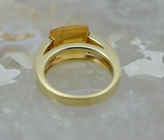 14K YG 8 ct. Checkerboard cut citrine ring with square stones, Art Deco look, 1/4 '' across, small chip to stone, circa 1990, ring size 6.75, weight 8.1 grams Stock # BB111R13 Most rings are sizable for a small fee. If the ring you are considering is the incorrect size contact us for a quote. This listing contains photographs of the actual item you will receive. Our items are in excellent condition with little or no signs of wear and many are one of a kind pre-owned estate finds. Please look clo Olivia Ross, Stones Art, Square Stone, Citrine Ring, Fine Jewelry Designers, Boston Ma, Blue Topaz Ring, Topaz Ring, Pink Tourmaline