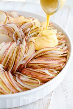 an apple pie is being drizzled with caramel and applesauce