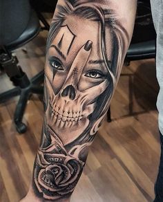 a person with a skull tattoo on their leg