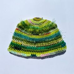 1 of 1 crocheted bucket hat using a mix of acrylic, cotton, and vintage yarns Casual Multicolor Handwoven Crochet Hat, Green Casual Crochet Hat In Acrylic Yarn, Multicolor Woven Crochet Hat, Bohemian Handwoven Crochet Yarn Hat, Casual Green Crochet Hat, One Size Yarn Mini Hats For Spring, Knitted Yarn Bucket Hat, Knitted Yarn Cloche Hat One Size, Multicolor Crochet Yarn Cap