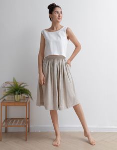 "This Pleated midi skirt is perfect for this summer, Crafted with 100% linen, featuring elasitc high waist and deep pocket, comfy and versatile ★★FEATURES 100% Linen Elastic waist Two side pockets Pleated skirt Regular fit A Line skirt No lining Perfect for Summer, Spring, Autumn ★★ Model Size Height approx 162 cm (5′ 4″) Bust 84 cm (33\") Waist 66 cm (26\") She wears size XS. ★★ Bespoke Order Service If you Request other color Request the length Your height is not between 155 cm- 172 cm Your we Summer Linen Flowy Skirt, Summer Linen Maxi Skirt With Elastic Waistband, Summer Linen Skirt With Elastic Waistband, Spring Linen Culottes With Pockets, Summer Linen Midi-length Bottoms, Summer Beige Flared Pleated Skirt, Summer Bottoms With Pockets, Midi Length, Linen Dresses With Relaxed Skirt For Spring, Flowy Linen Pleated Skirt