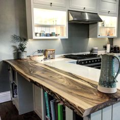 the kitchen counter is made out of wood