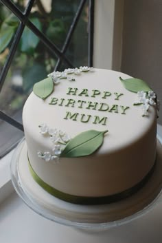 a birthday cake sitting on top of a window sill