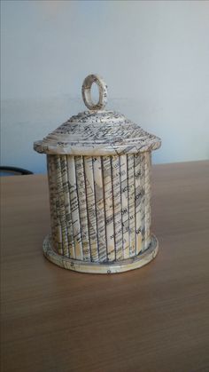 a small basket sitting on top of a wooden table