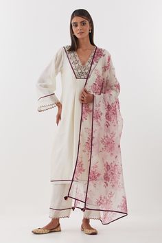 Ivory kurta featuring delicate zardozi embroidery on placket. Comes with scalloped hem pant, inner slip and floral print dupatta.
Components: 4
Pattern: Embroidered, Printed
Type Of Work: Floral, Zardozi
Neckline: V-neck
Sleeve Type: Three quarter
Fabric: Chanderi Silk, Silk Organza
Color: Ivory
Other Details: 
Scalloped embroidered borders
Tasselled dupatta
Box pleats on kurta
Occasion: Mehendi and Haldi - Aza Fashions Zardozi Embroidery, Kurta Set For Women, How To Hem Pants, Silk Organza, Fashion App, Embroidery Fashion, Box Pleats, Kurta Set, Scalloped Hem