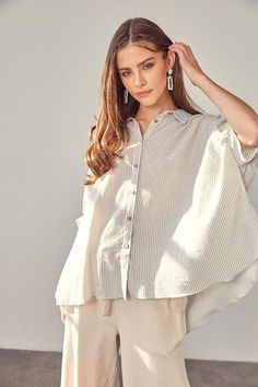 This button-up collared shirt is perfect for casual weekend wear. Loose-fit and crafted from rayon, it's comfy and chic for any occasion. With a classic striped pattern, a hi-low silhouette and cool half-sleeves, this is surely one of your closet's must-haves. (Wear it with a half-tuck to show off your best assets!)- Print/ Pattern: Stripe- Neckline: Collar- Silhouette: Hi- low shirt- Embellishment: Button- Length: Tops 26" & Longer- Sleeve: Half- Fit: Loose- Closure: Button- Lining: NA- Care In Oversized Shirts Women, Button Up Shirt Womens, Oversized Shirts, Tailored Design, Weekend Wear, Casual Elegance, Sheer Fabrics, Print Pattern, Casual Wardrobe